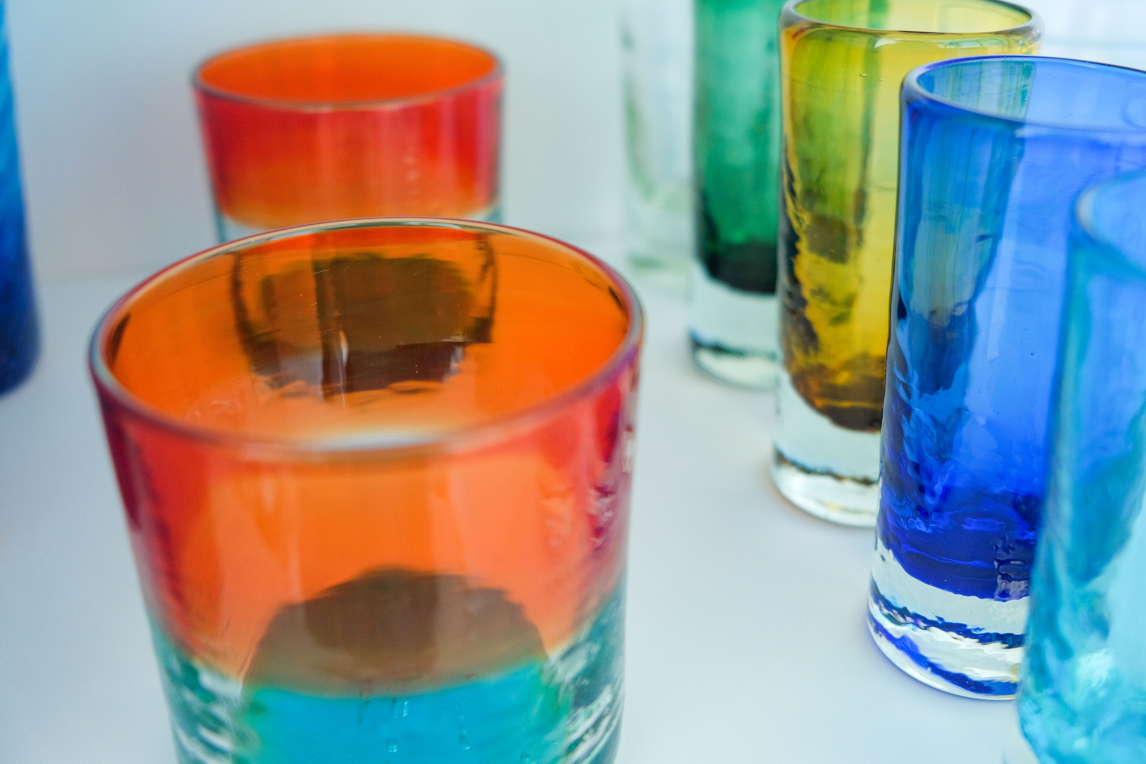 A row of colorful glass bottles.