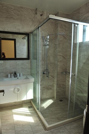 Shower, free toiletries, hair dryer, slippers