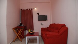 Executive Room | Living area | 24-inch LED TV with cable channels, TV - The Chandy's- Your hotel people (Kanayannur)