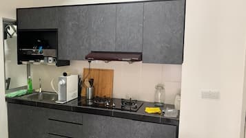 Fridge, electric kettle, cookware/dishes/utensils