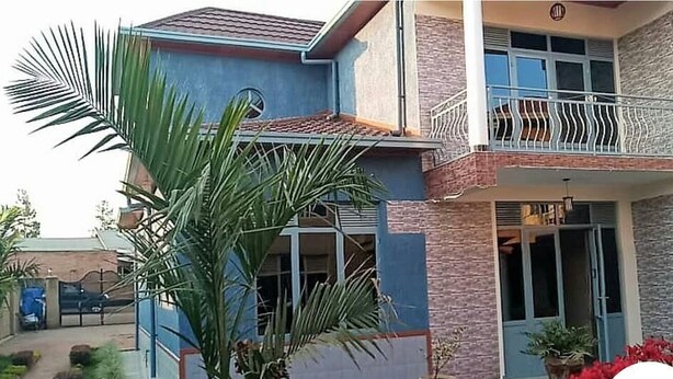 A two-story building with a balcony on the upper floor. - Nova Apartment (Kigali)