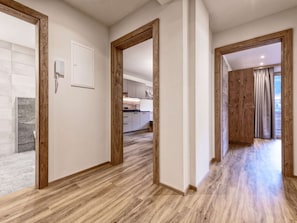 Experience a clean and contemporary atmosphere in this stylish space, featuring a kitchen area and open layout.