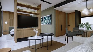A modern living room with a flat-screen TV, a dining area with a table and chairs, and a sofa.