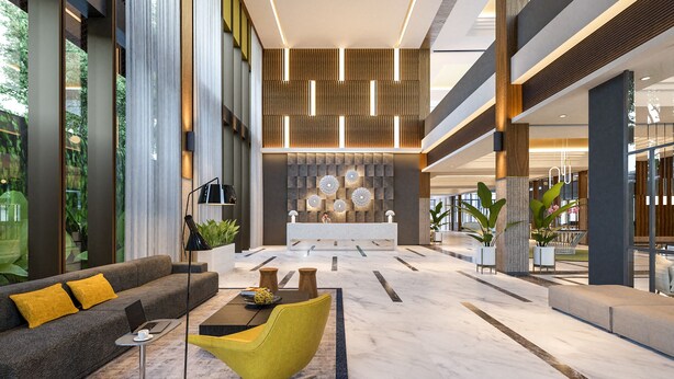 A modern lobby with a reception desk, a sofa, a yellow chair, and a marble floor.