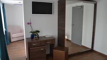 Family Triple Room, Multiple Beds | Living area | Smart TV, toys