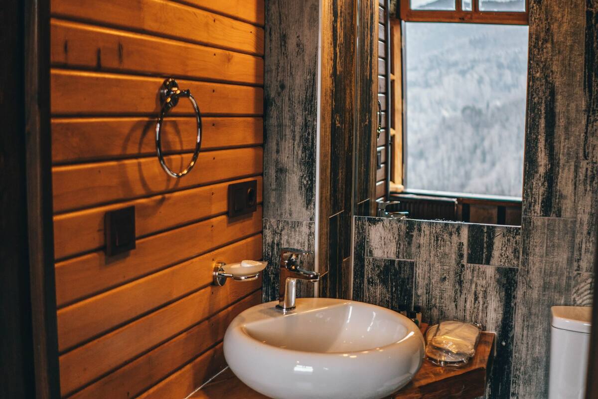 shower, hair dryer, slippers, towels