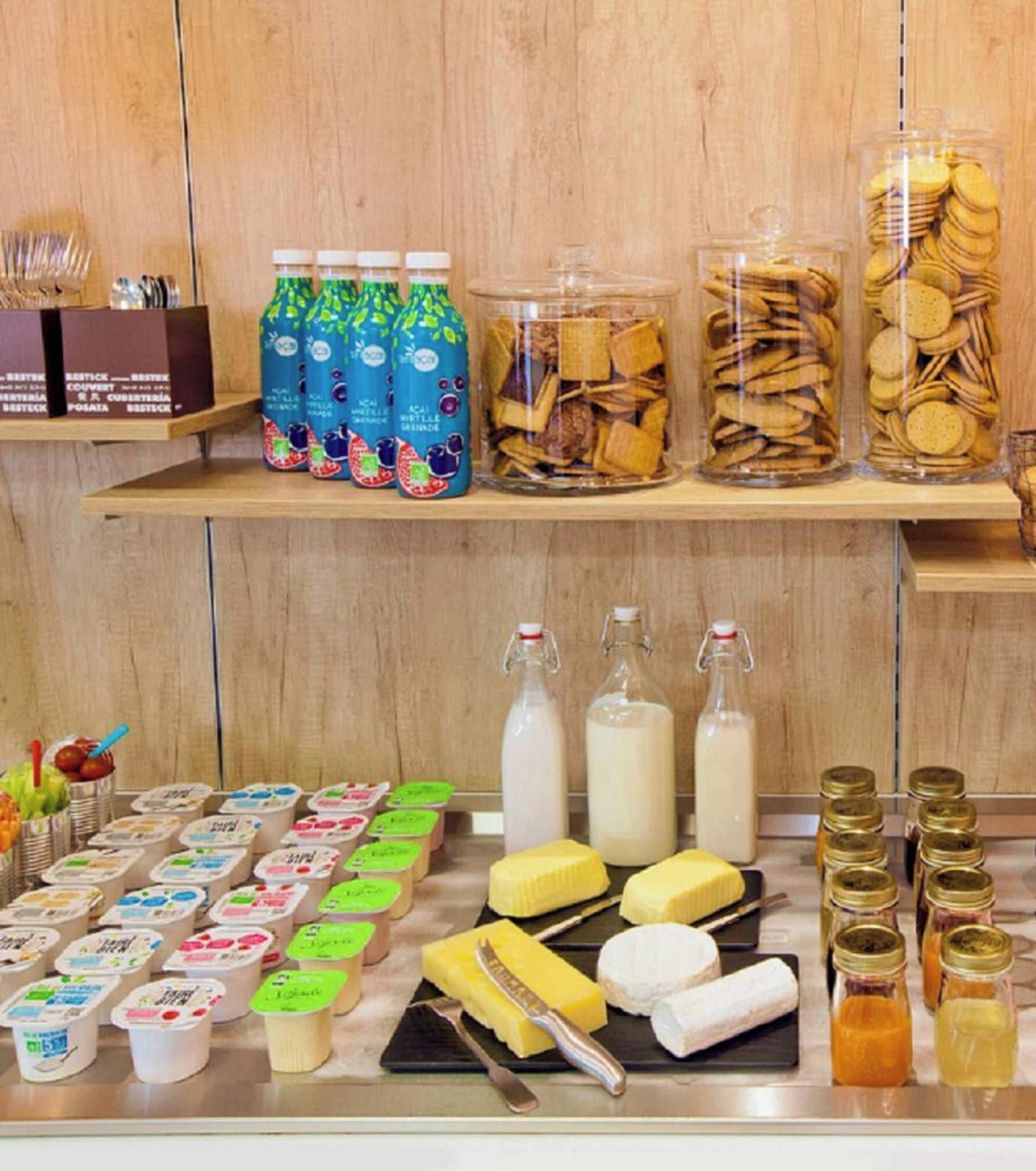 A variety of food items including bottles, jars, and packaged goods on display.