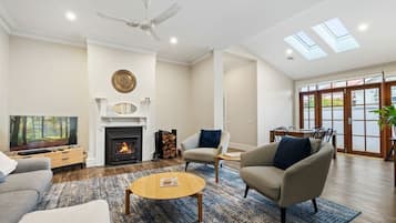 TV, fireplace, books, offices