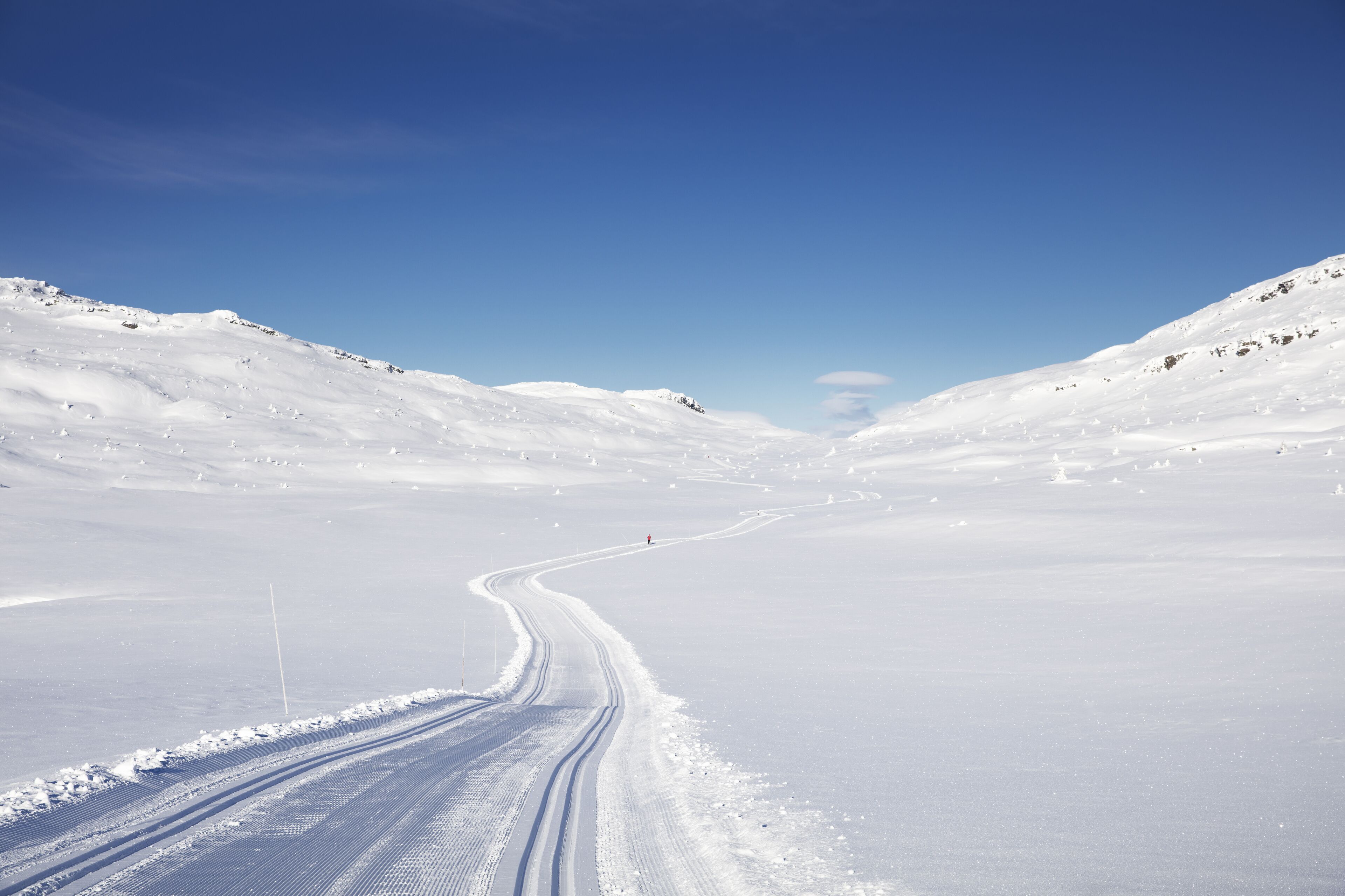 A snow-covered landscape with a clear sky.