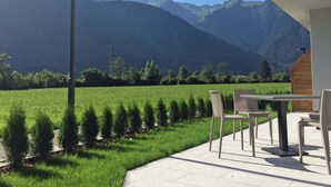 A patio with outdoor seating overlooking a mountain landscape. - Chalet in Mayrhofen Near Ski Lifts (Schwendau)