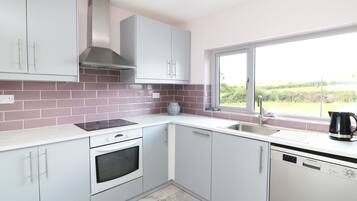 Cottage | Private kitchen | Fridge, oven, stovetop, dishwasher
