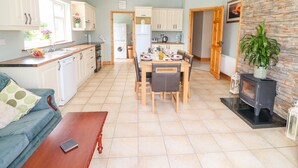 A compact living space with a kitchen, dining area, and a cozy seating area. - Artigallivan (Killarney)