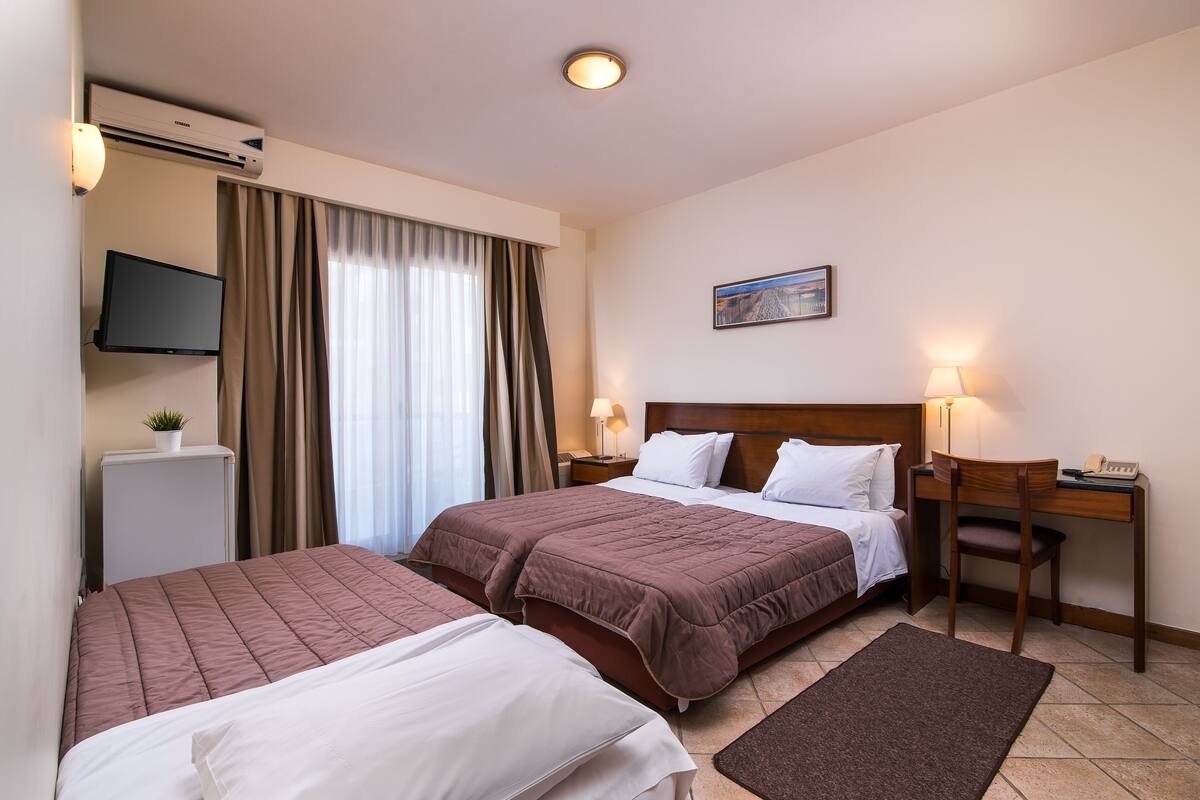 Triple Room, City View | Iron/ironing board, free cots/infant beds, free WiFi, bed sheets