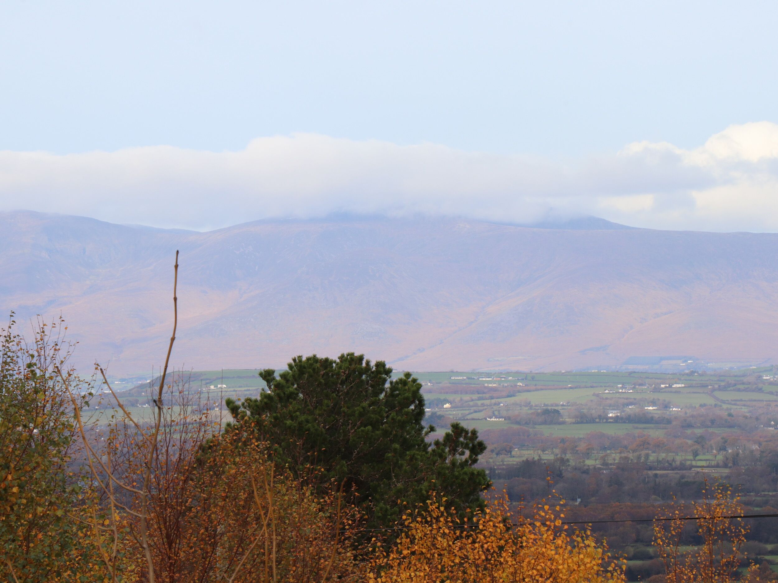 A mountainous landscape with a valley in the background.