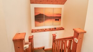 A wooden staircase with a wooden handrail and a wooden railing at the top. - Silver Birch (Creegh)
