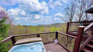 A hot tub on a wooden deck with a view of a forested landscape. - Bear Necessities - Hot tub, View, Spectacular! (Ferguson)