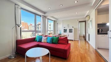 Apartment (2 Bedrooms) | Living area | 65-inch TV with cable channels