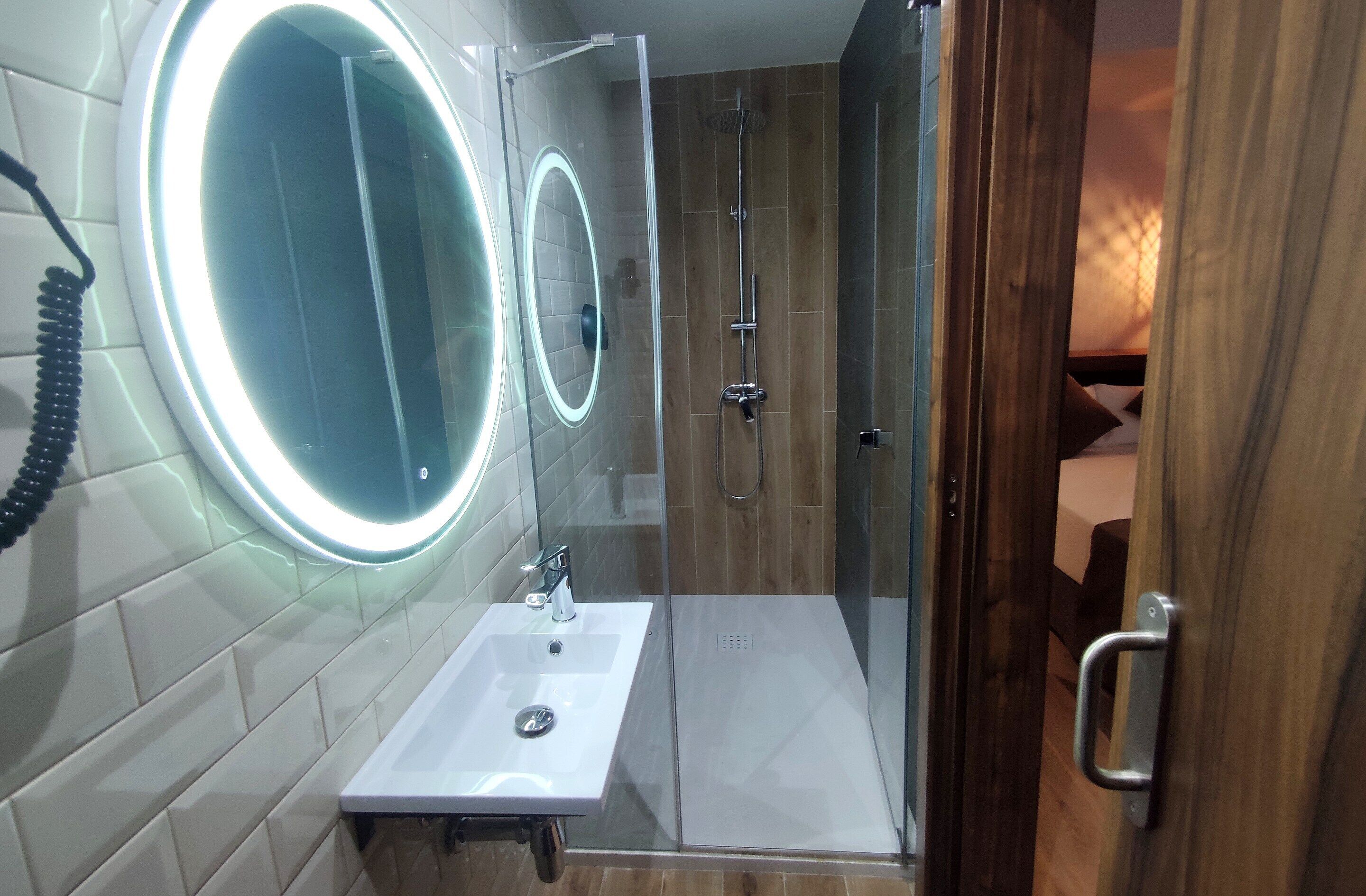 standard single room | bathroom | shower, hair dryer, towels, soap