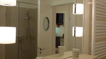 Bathtub, hair dryer, soap, toilet paper