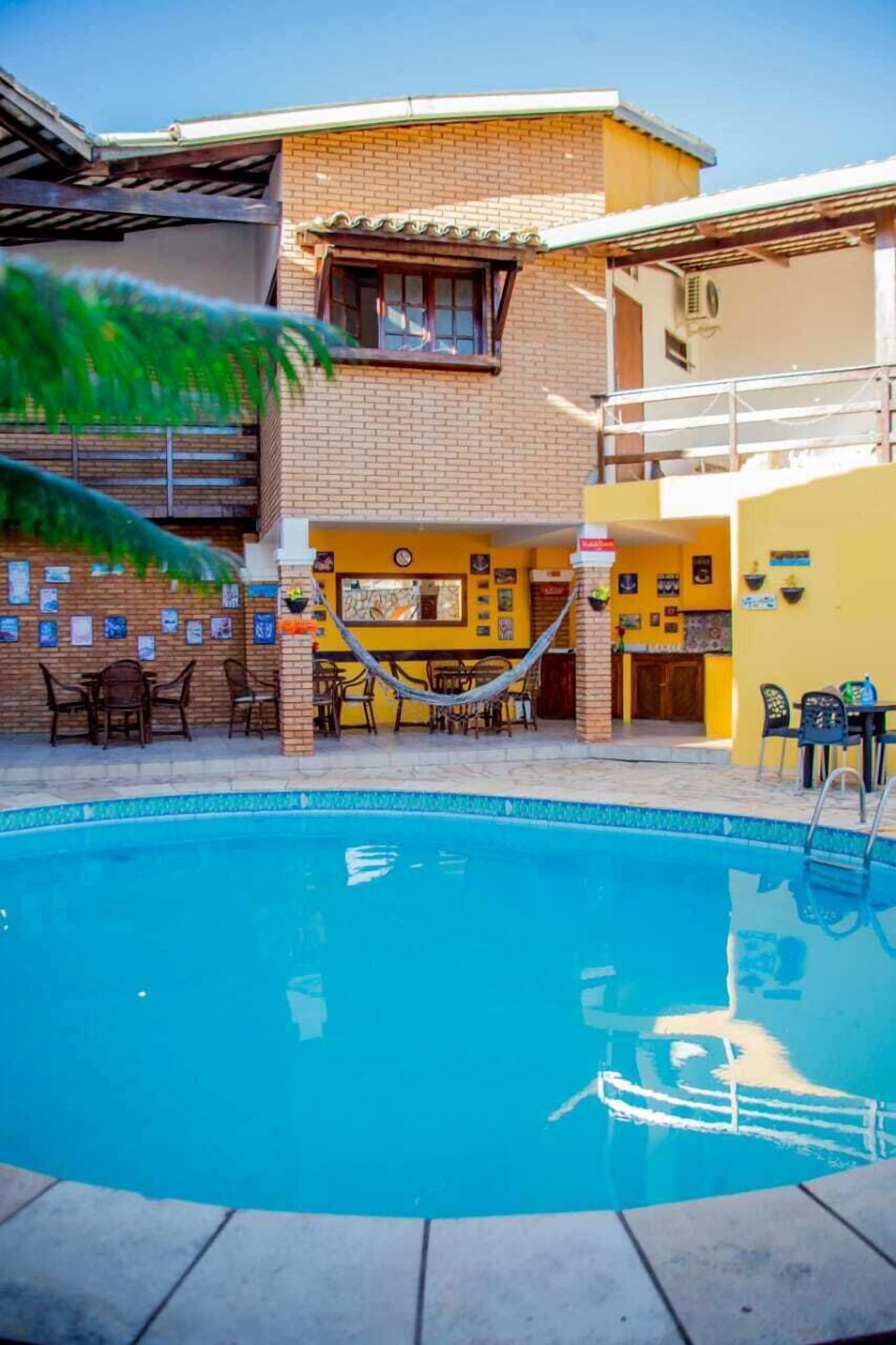 on the beach, white sand, beach umbrellas, beach towels