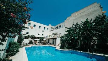 Outdoor pool, open 8:00 AM to 8:00 PM, pool umbrellas, pool loungers