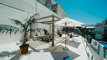 Outdoor pool, open 8:00 AM to 8:00 PM, pool umbrellas, sun loungers