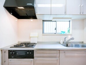 A modern kitchen with stainless steel appliances, a window, and a sink. - Entire 2Story HouseDirect to AirportWiFiMax6 - Katsushika Takasago House / Katsushika-ku Tokyo (Katsushika-ku)