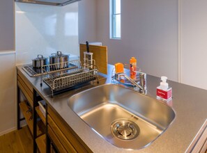 Fridge, microwave, stovetop, cookware/dishes/utensils