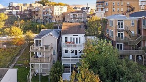A residential area with multi-story buildings, some with balconies and a mix of architectural styles.
