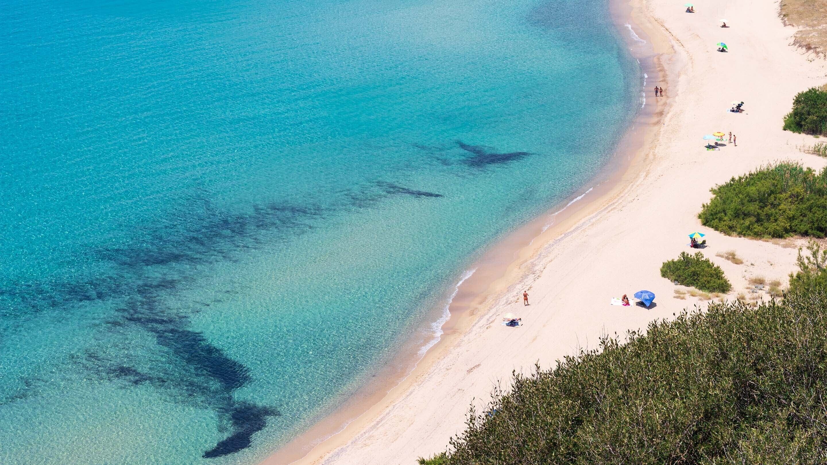 Beach nearby, white sand, beach umbrellas, beach towels