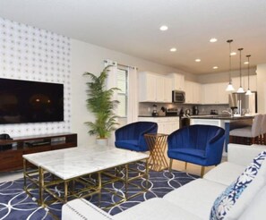 House | Living room | Flat-screen TV, DVD player - Stunning 8 Bedroom 6 Bath Pool Home in Windsor at Westside (Kissimmee)