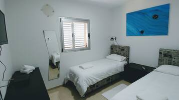 Blackout curtains, iron/ironing board, free WiFi, bed sheets