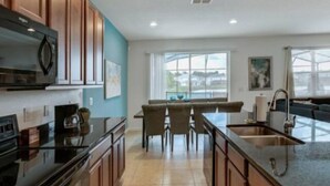 House | Private kitchen | Coffee/tea maker, fridge, microwave, stovetop - Lake View 6 Bedroom 4 Bath Pool Home in Bella Vida Resort (Kissimmee)