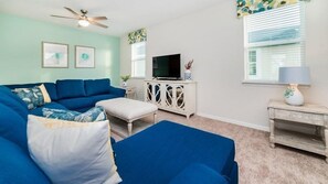 House | Living room | TV, DVD player, foosball - Beautiful Solara Resort 7 Bedroom Home (Kissimmee)