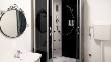 Combined shower/tub, hair dryer, towels, soap