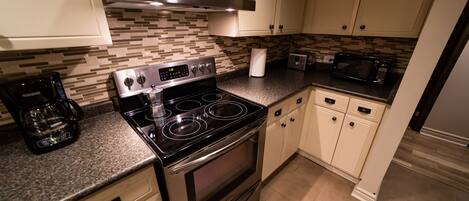 Microwave, dishwasher, coffee/tea maker, cookware/dishes/utensils