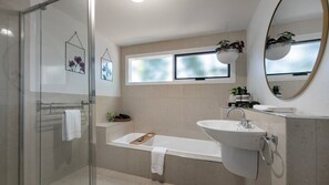 Bathtub, hair dryer, towels