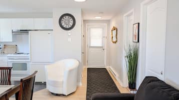 Family Apartment, Multiple Beds (552) | Living area | 50-inch Smart TV with cable channels