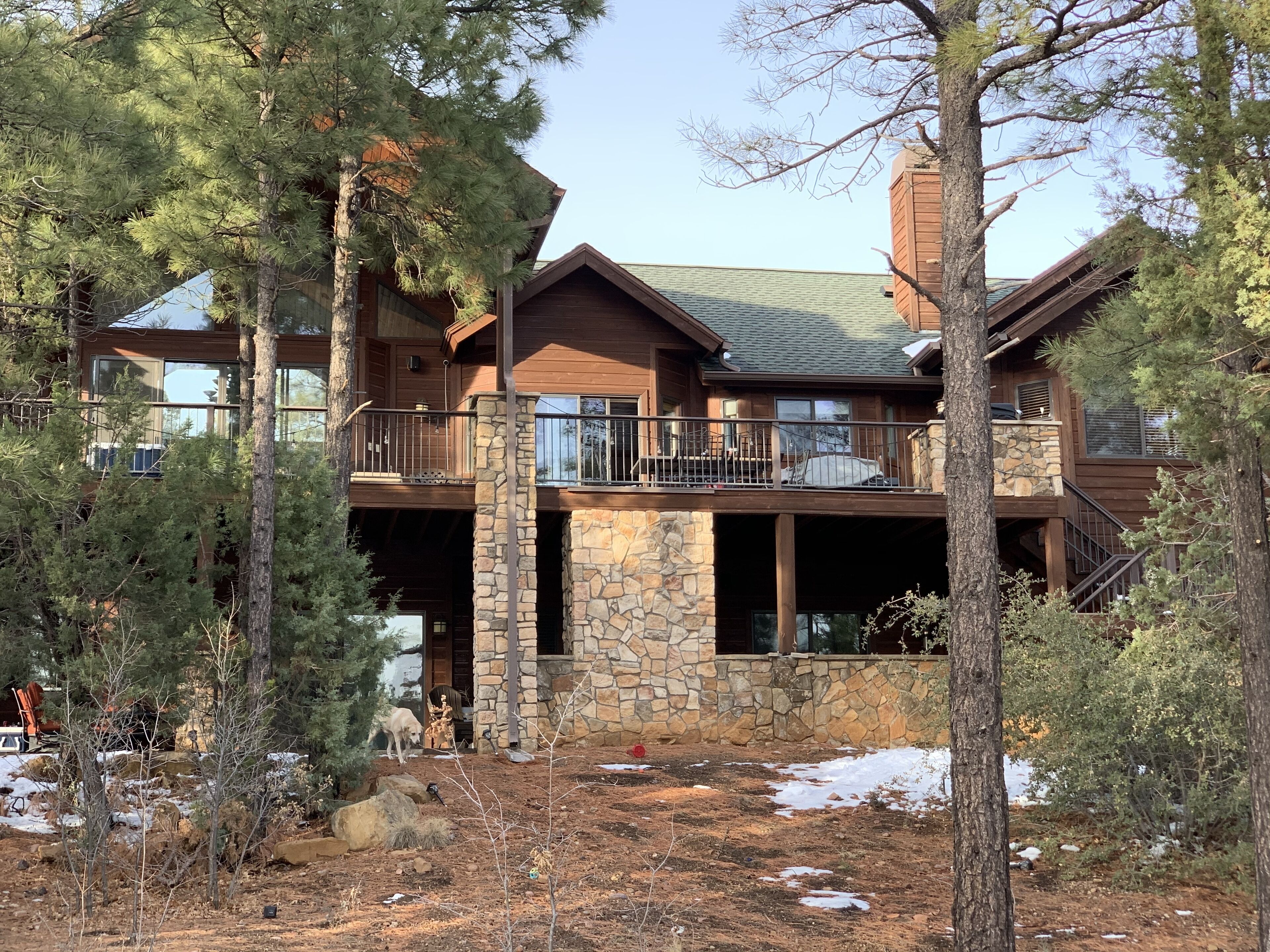 Large beautiful cabin home with hot tub under the pine trees.