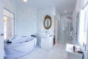 Shower, jetted tub, hair dryer, towels