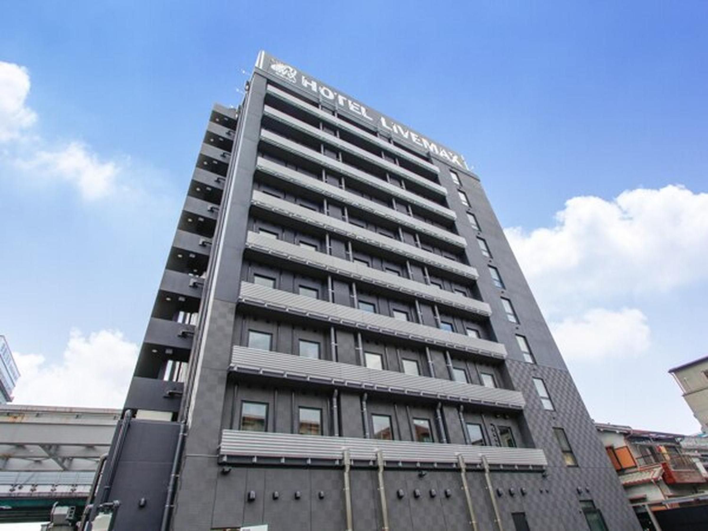 A modern hotel building with multiple floors and balconies.