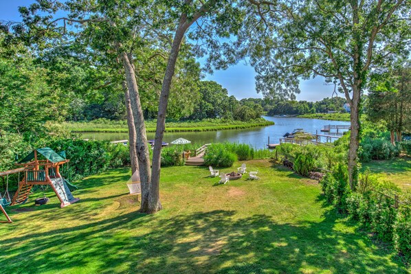 A lakeside park with a playground, picnic area, and walking paths. - Live on the Water: Dock, Beach, Boat, Kayak & Fish (Southampton)