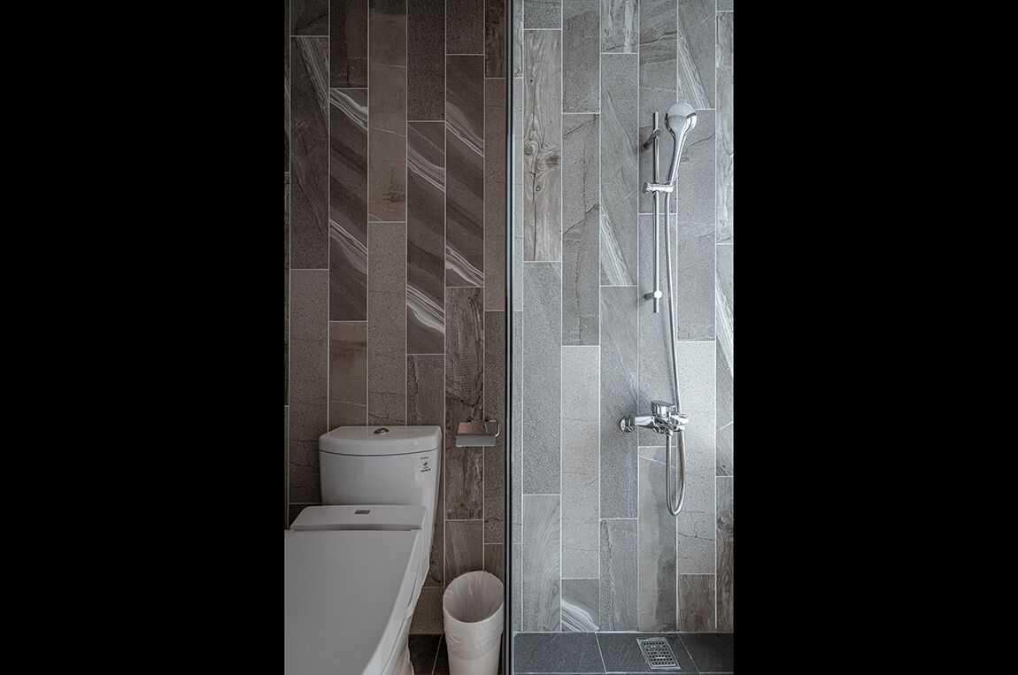 deluxe view room with bathtub | bathroom | eco-friendly toiletries, hair dryer, slippers, towels