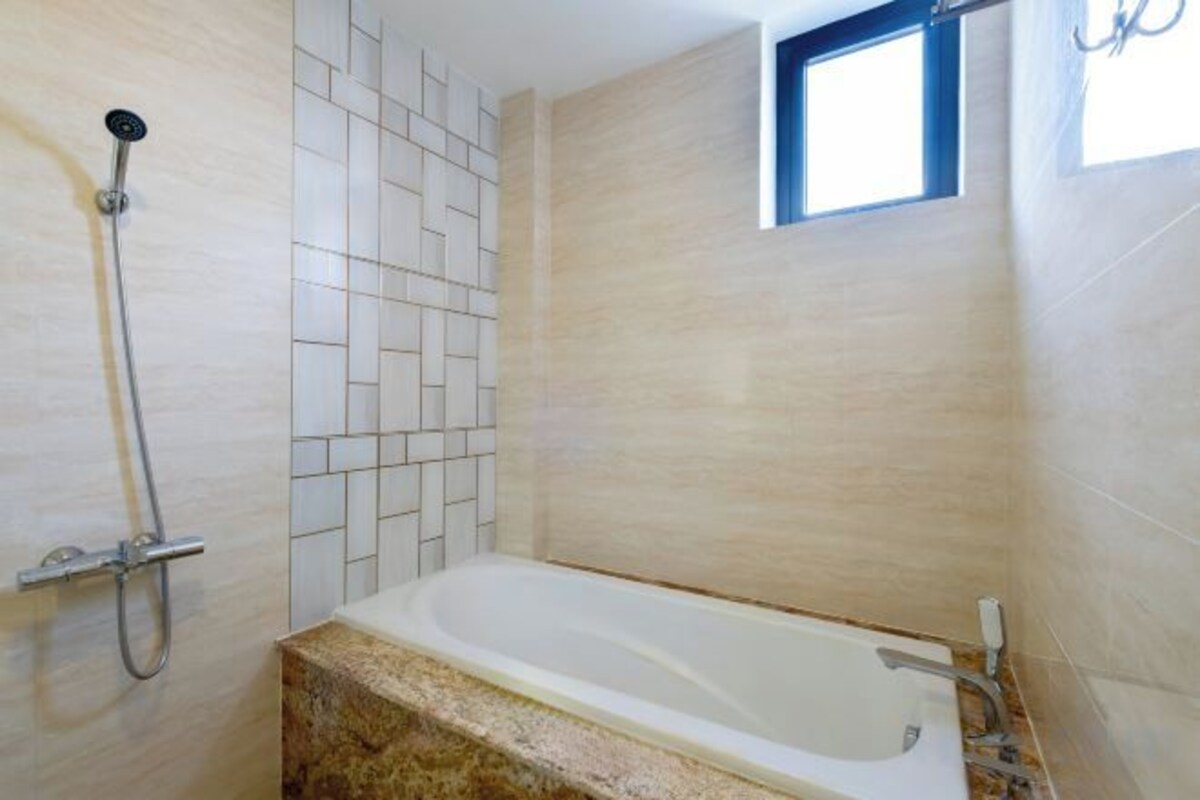 Bathroom | Deep soaking tub, free toiletries, hair dryer, slippers