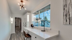 A modern kitchen with white cabinetry, a large window, and a globe on the counter. - OLD TOWN + HOME + HEATED Private POOL + 4 Bed/ 2.5 Bath + NEW Remodel+ Game Room (Scottsdale)