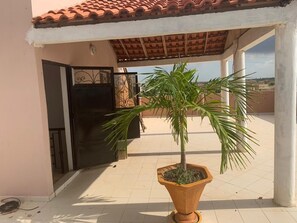 Enjoy the tranquil atmosphere of this Mediterranean-style outdoor space, featuring a central planter and a, secure area.