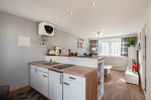 Fridge, coffee/tea maker, electric kettle, toaster