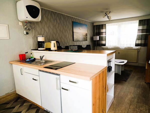 Fridge, coffee/tea maker, electric kettle, toaster