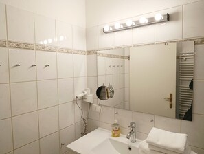 Shower, hair dryer, towels, soap