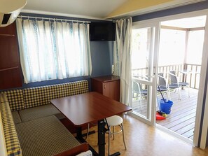 Family Bungalow, 2 Bedrooms, Terrace (4 Pax) | Living room | Flat-screen TV - Camping Rio Nela (Trespaderne)